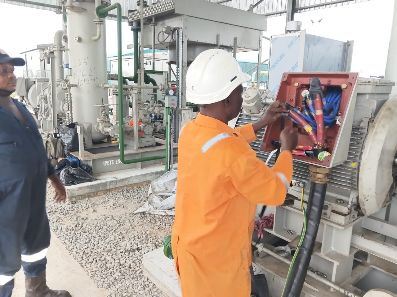 IPETS field engineer working on electrical installation at a facility